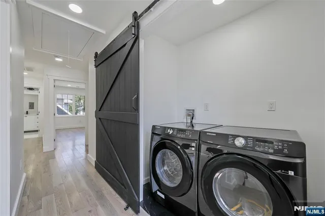 a view of a storage & utility room with washer and dryer