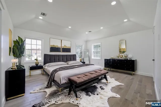 a bedroom with a bed and a couch