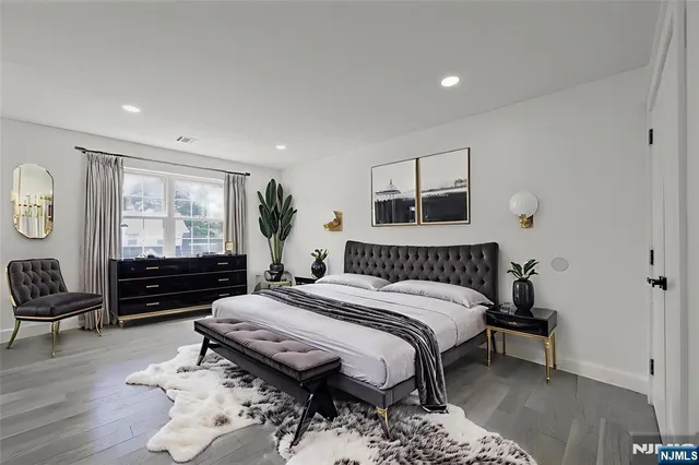 a bed room with a bed and furniture