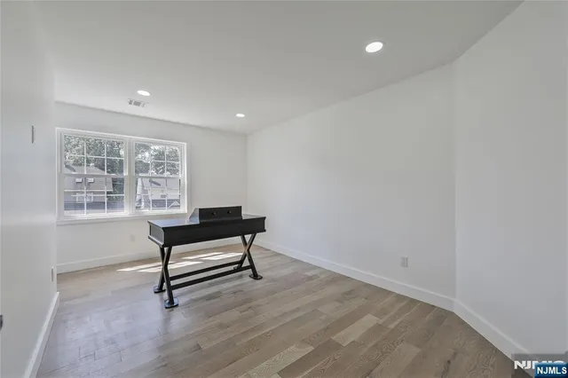 a bench sitting in a room next to a window