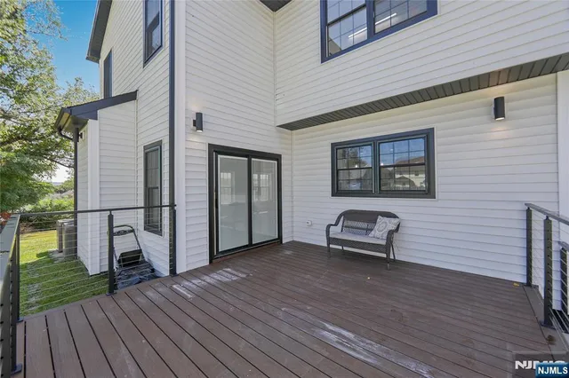 a view of a car with brick wall