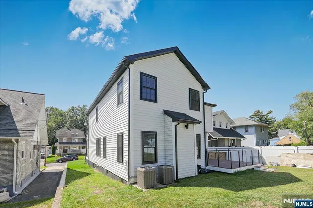 a view of house with yard and entertaining space
