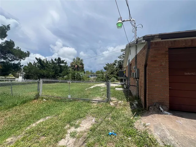 a backyard of a house with lots of green space