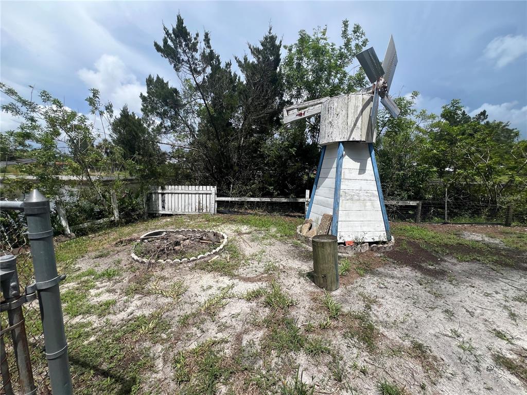 14830 Atlantic Avenue Hudson, FL 34667 - Photo 21 of 26 a backyard of a house with portable swimming pool and outdoor seating