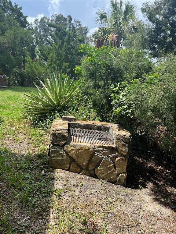 14830 Atlantic Avenue Hudson, FL 34667 - Photo 26 of 26 a view of a roof deck with table and chairs and potted plants