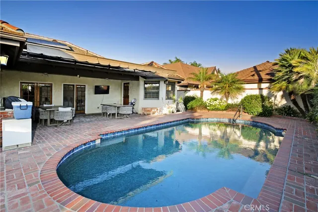 a view of a house with swimming pool
