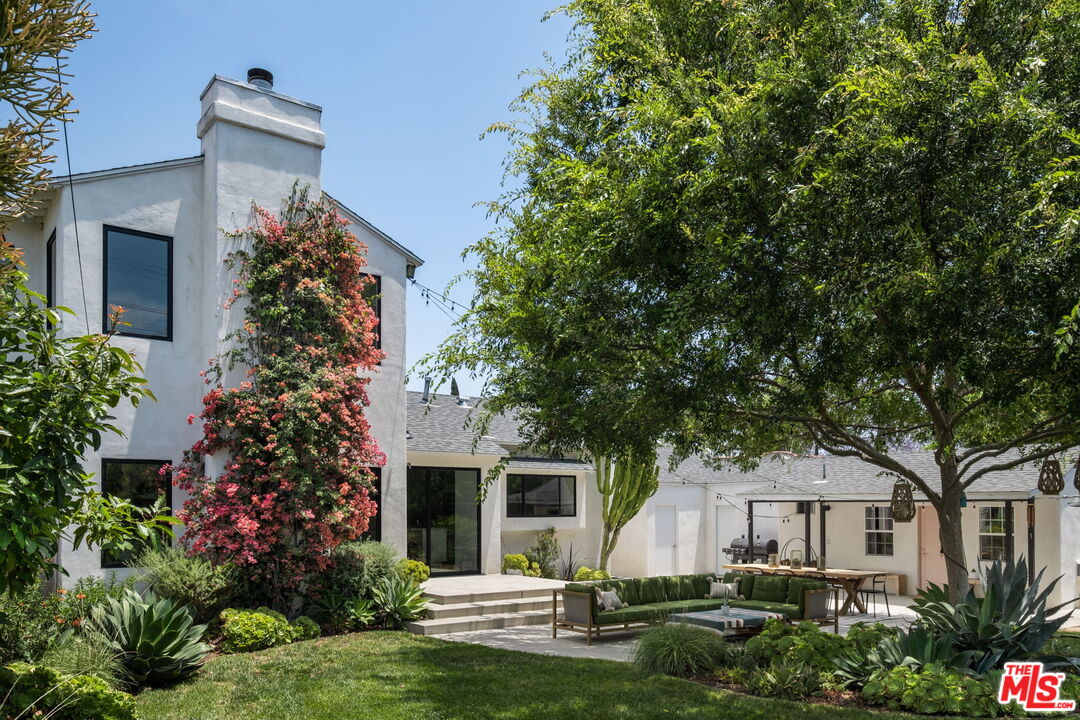 front view of a house with a garden