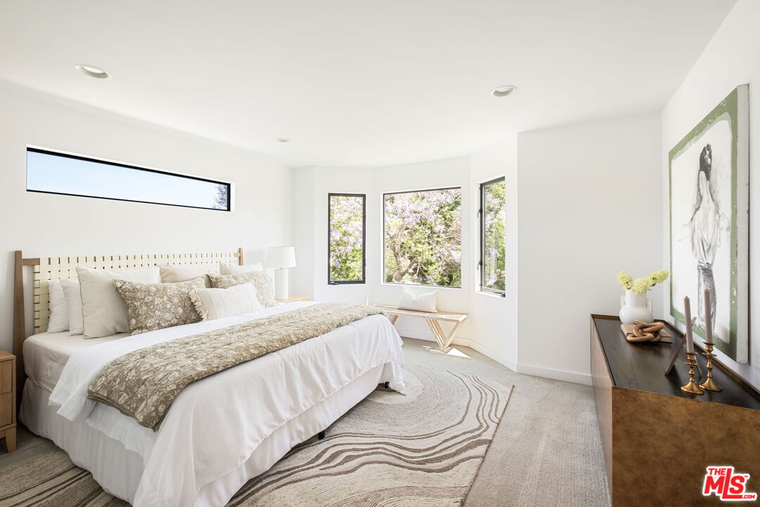 3414 Ferncroft Road Los Angeles, CA 90039 - Photo 22 of 47 a bedroom with a large bed and a flat tv screen on dresser