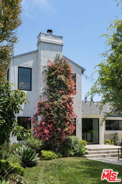 3414 Ferncroft Road Los Angeles, CA 90039 - Photo 32 of 47 a front view of a house with a garden
