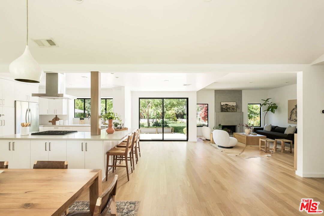 3414 Ferncroft Road Los Angeles, CA 90039 - Photo 4 of 47 a living room with furniture a wooden floor and a large window