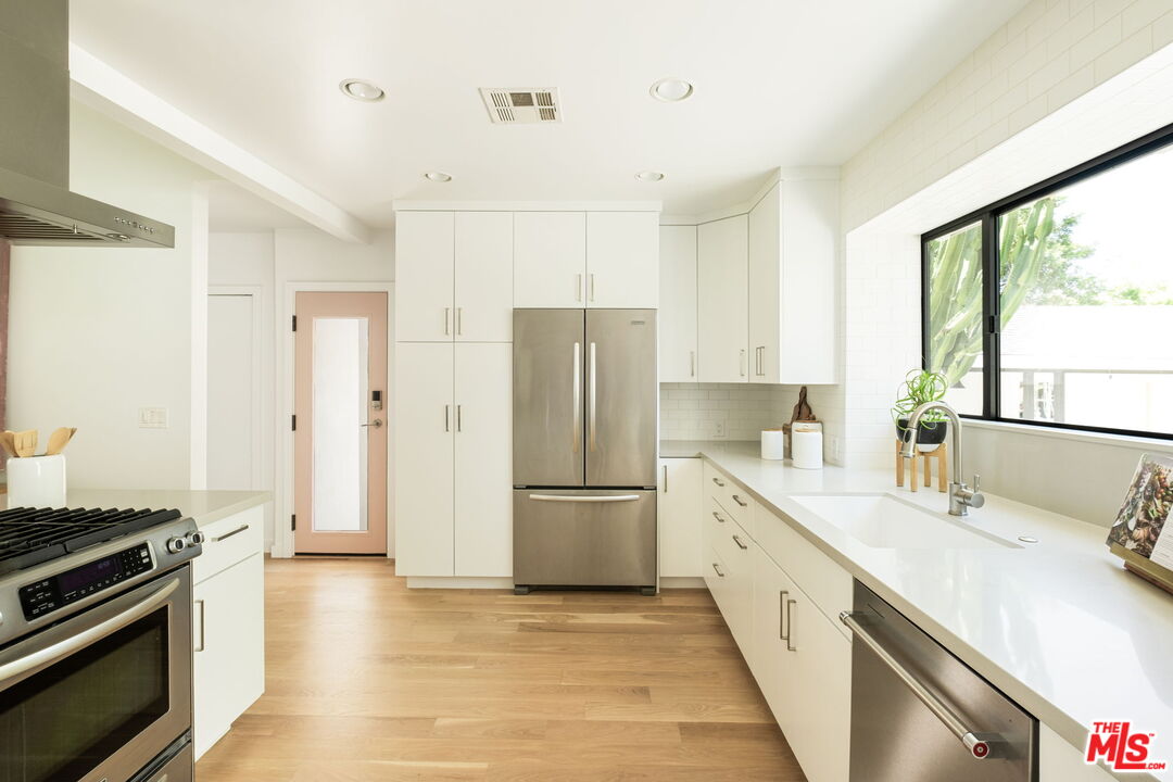 3414 Ferncroft Road Los Angeles, CA 90039 - Photo 10 of 47 a kitchen with a sink stove and refrigerator