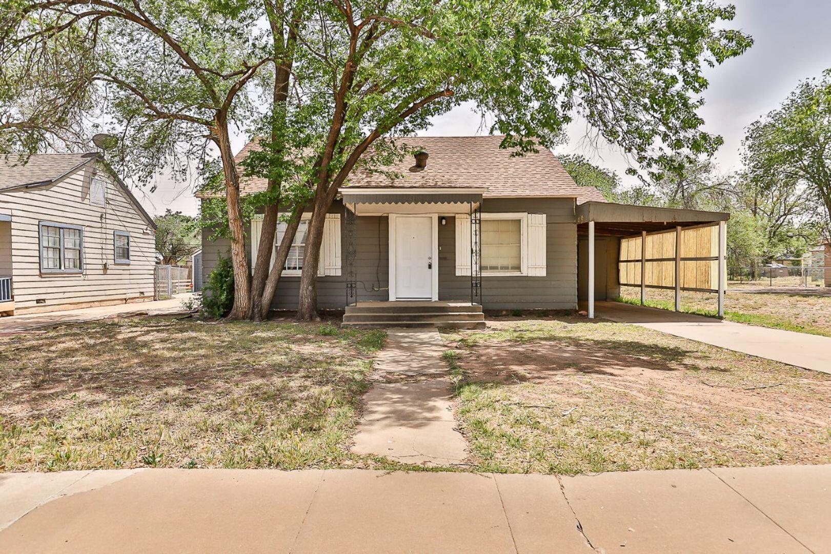 2311 25th Street Lubbock, TX 79411 - Photo 1 of 14 front view of a house with a yard