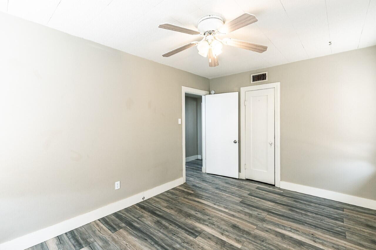 2311 25th Street Lubbock, TX 79411 - Photo 11 of 14 a view of an empty room with wooden floor