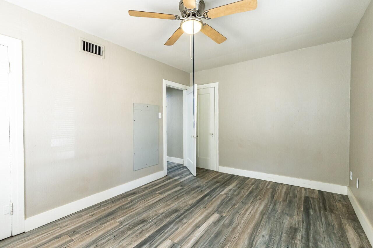 2311 25th Street Lubbock, TX 79411 - Photo 13 of 14 a view of a room with wooden floor and an entryway