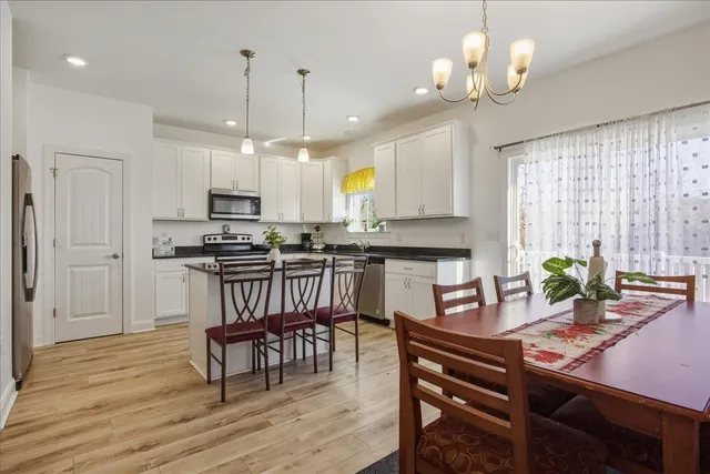 a view of kitchen with sink microwave and cabinets