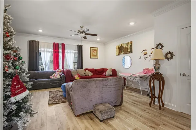 a living room with furniture and flowers