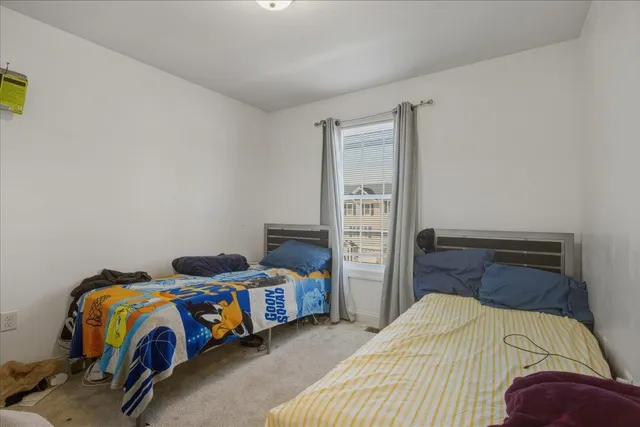 a bedroom with a bed and closet