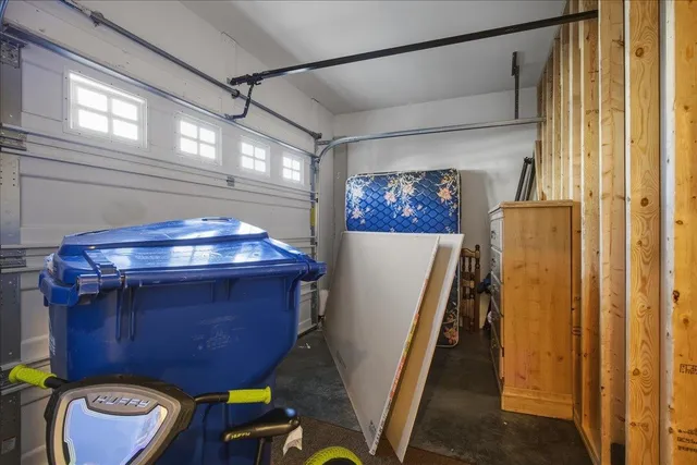 a view of a room with wooden floor and windows