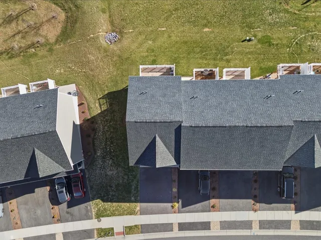 an aerial view of a house with a ocean view