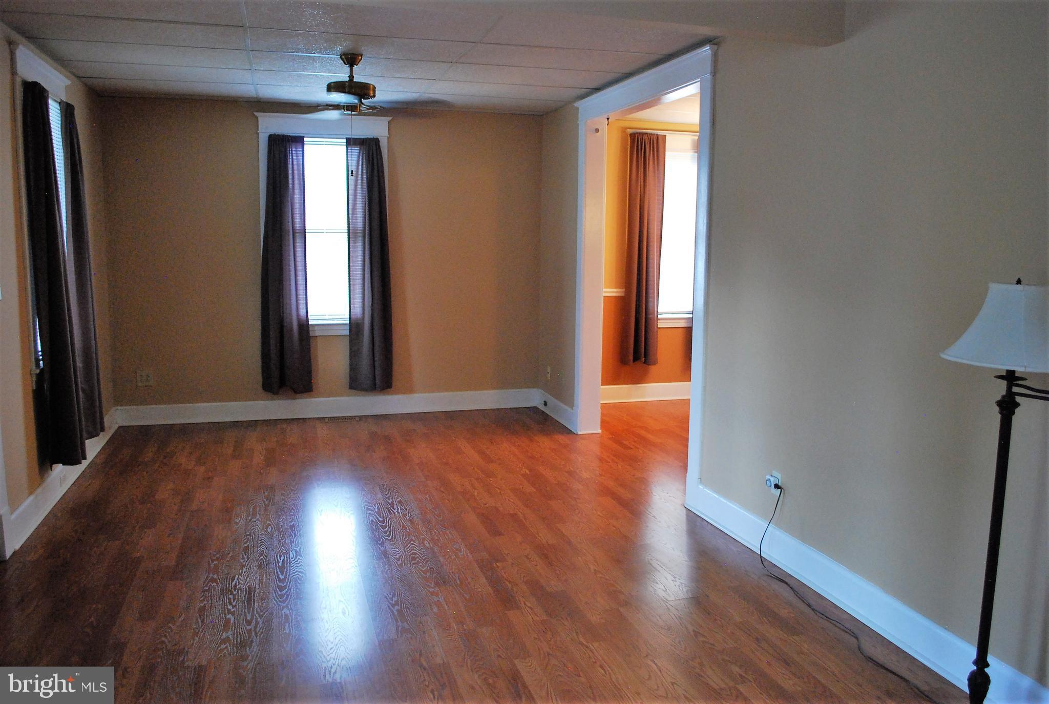 4333 Ridge Avenue Baltimore, MD 21227 - Photo 6 of 35 Living Room's gleaming floors + higher ceilings