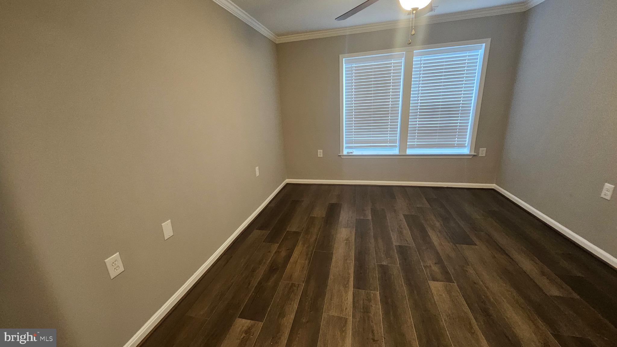 14224 Jib Street, Unit 6142 Laurel, MD 20707 - Photo 11 of 15 a view of a room with wooden floor and window