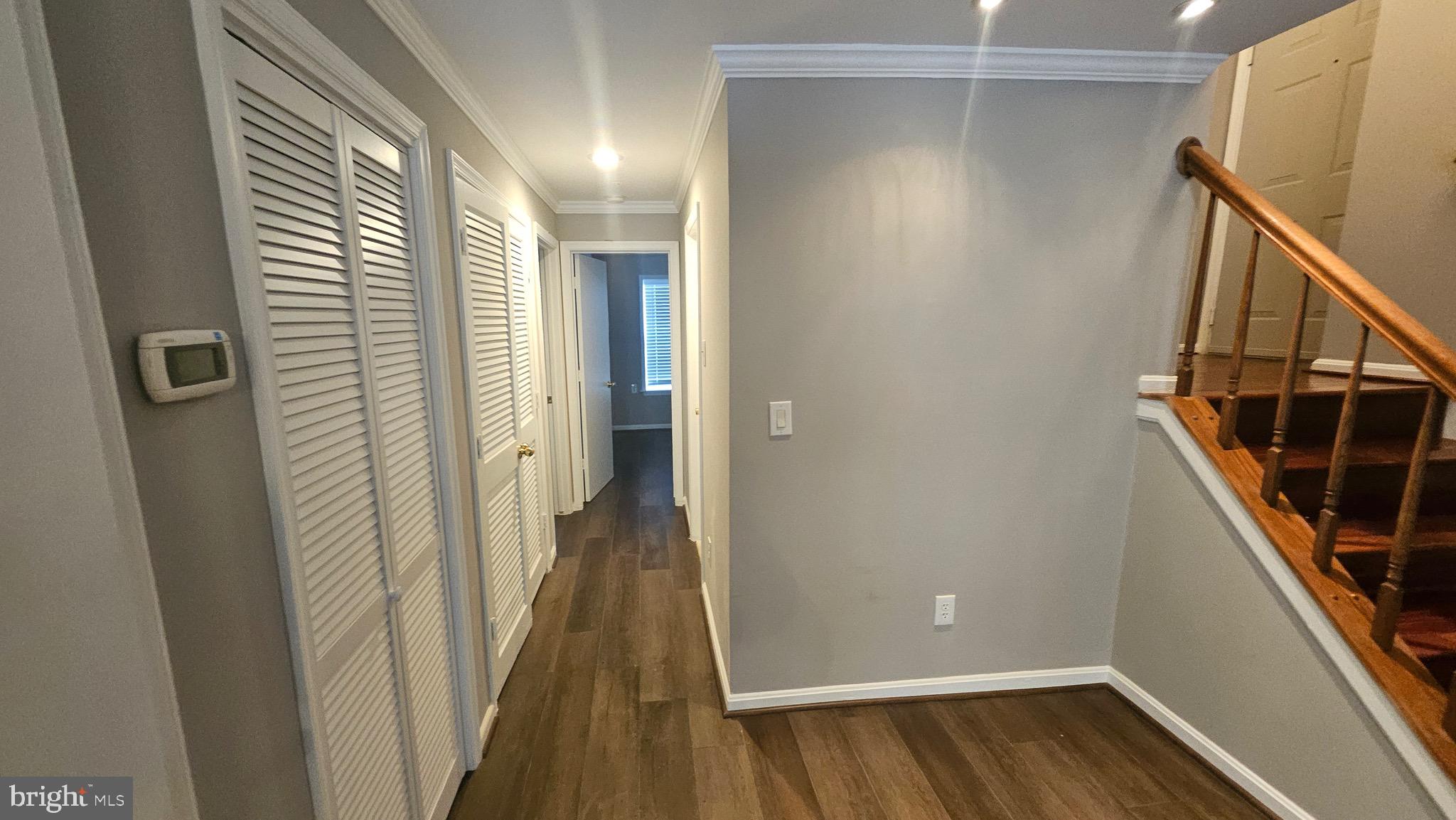 14224 Jib Street, Unit 6142 Laurel, MD 20707 - Photo 12 of 15 a view of a hallway with wooden floor and staircase