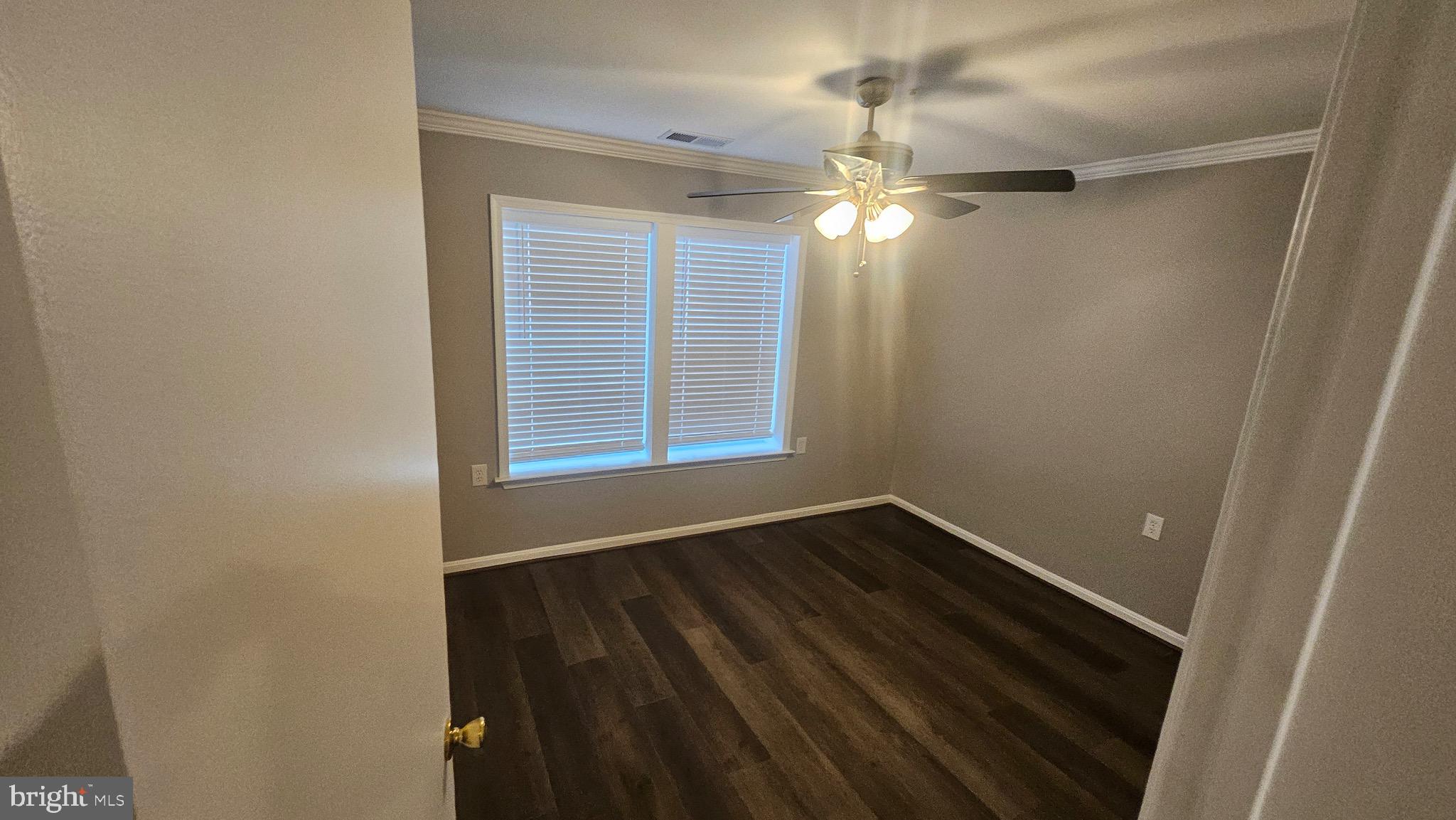 14224 Jib Street, Unit 6142 Laurel, MD 20707 - Photo 13 of 15 a view of empty room with wooden floor and fan