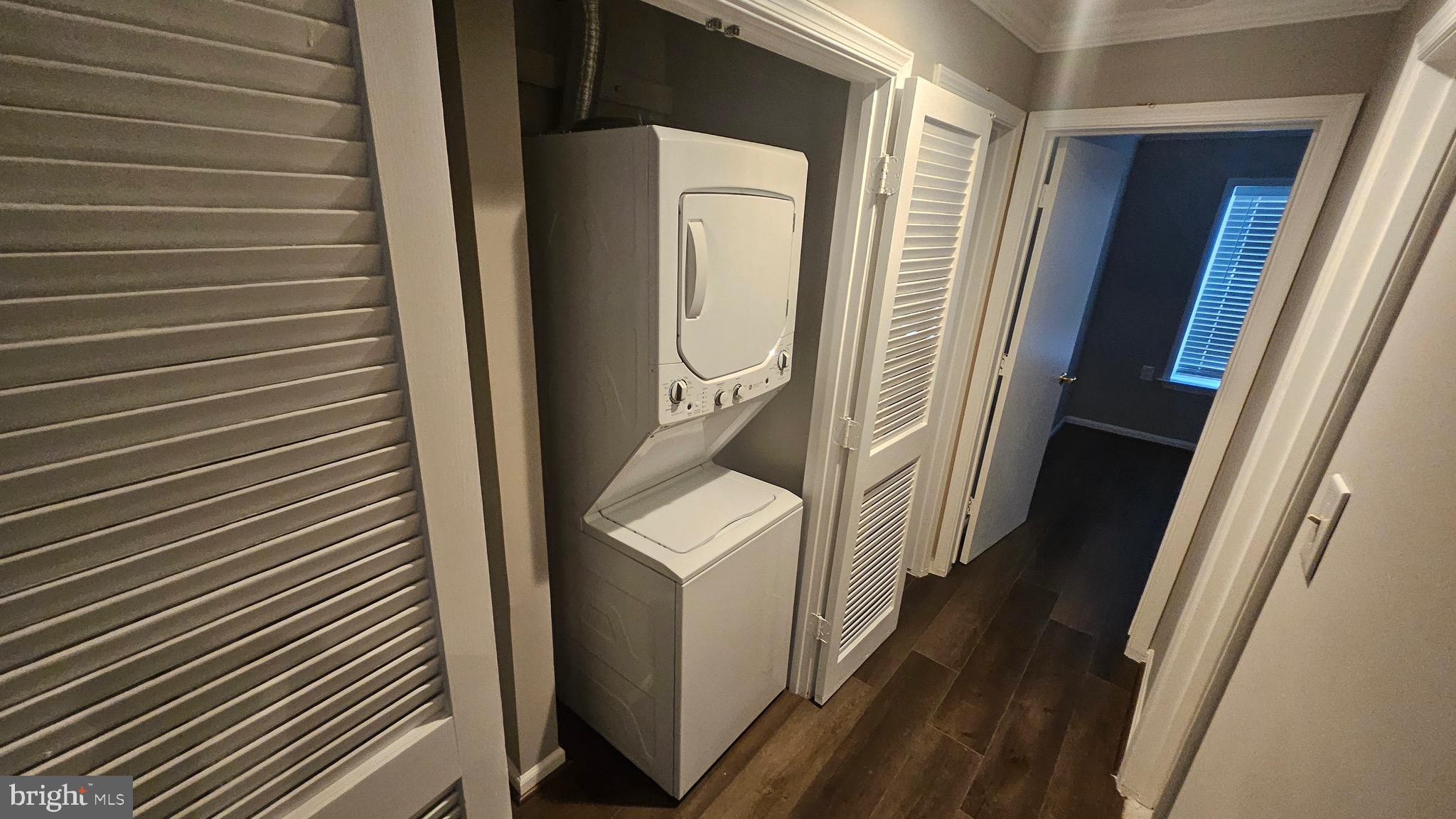 14224 Jib Street, Unit 6142 Laurel, MD 20707 - Photo 15 of 15 a utility room with wooden floor washer and dryer
