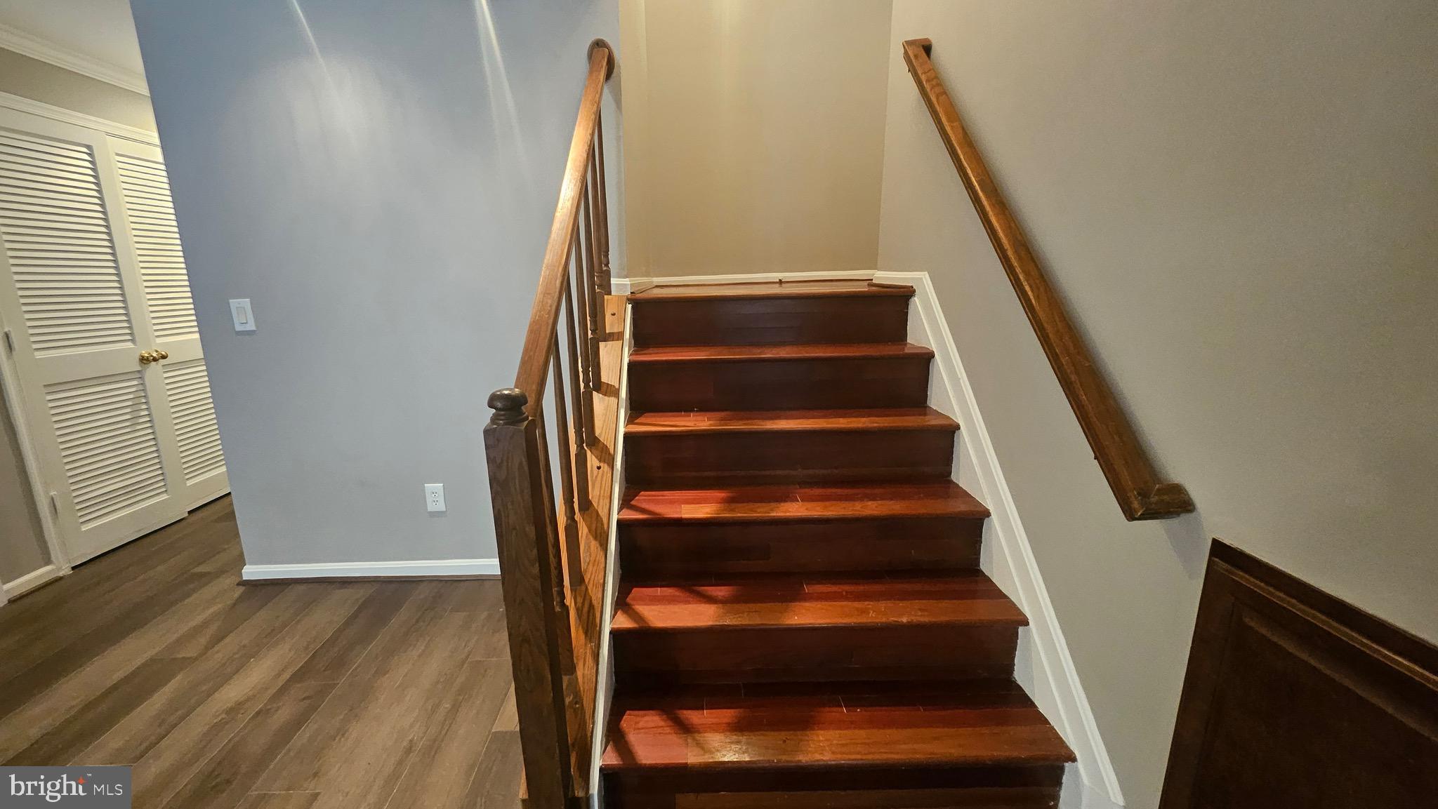 14224 Jib Street, Unit 6142 Laurel, MD 20707 - Photo 2 of 15 a view of staircase with wooden floor and white walls