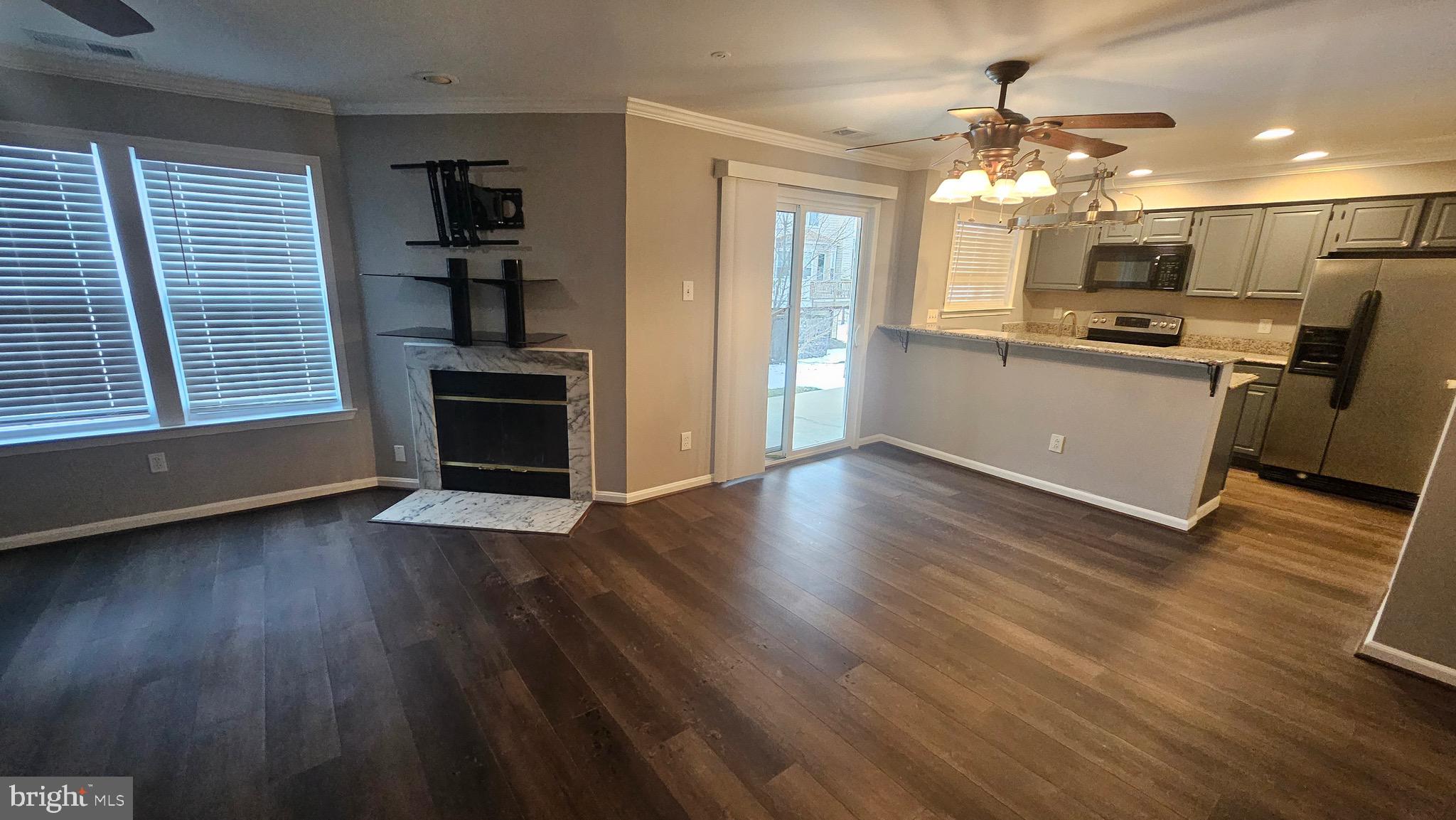 14224 Jib Street, Unit 6142 Laurel, MD 20707 - Photo 6 of 15 a view of a kitchen with microwave and cabinets