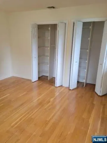 an empty room with closet area