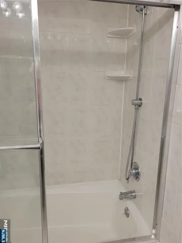 a kitchen with granite countertop wooden cabinets and a stove