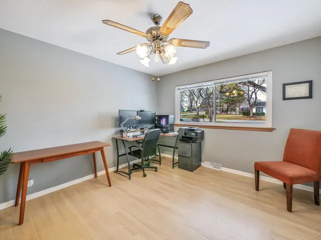 a view of a workspace with furniture and a workspace