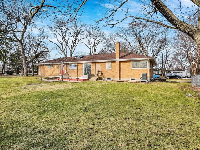 a swimming pool with outdoor seating yard and barbeque oven