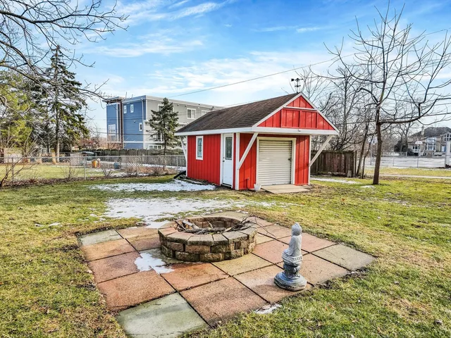 a view of swimming pool with a yard and tree