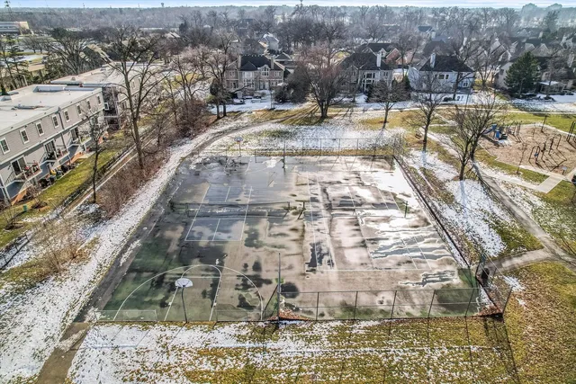 a view of a swimming pool with a yard and mountain view