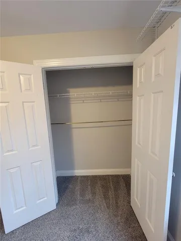 a bathroom with a sink toilet and mirror