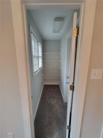 a bathroom with a sink toilet and a mirror