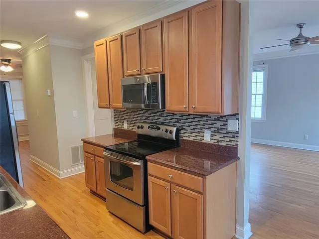 an empty room with a empty space and windows