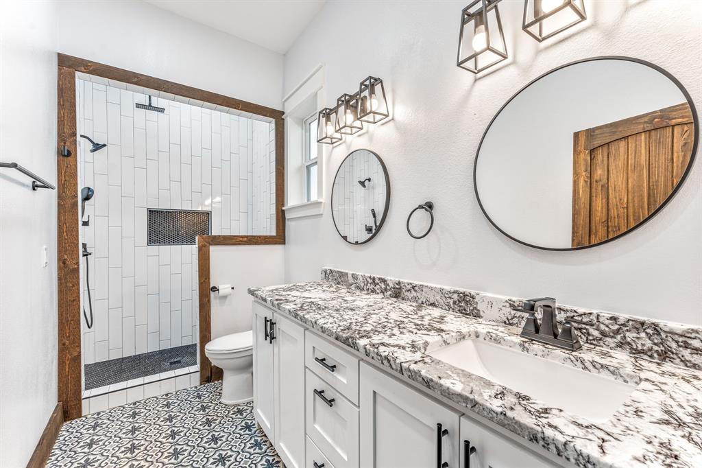 239 32507th Road Paris, TX 75460 - Photo 39 of 40 Bathroom with walk in shower, vanity, and light tile patterned floors