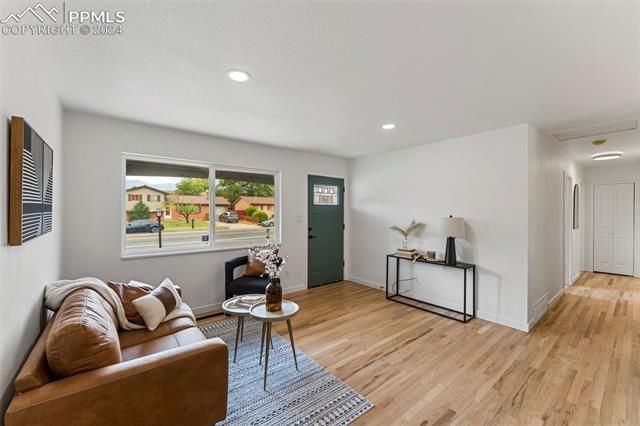 1911 Monterey Road Colorado Springs, CO 80910 - Photo 5 of 30 Living room featuring light hardwood / wood-style floors