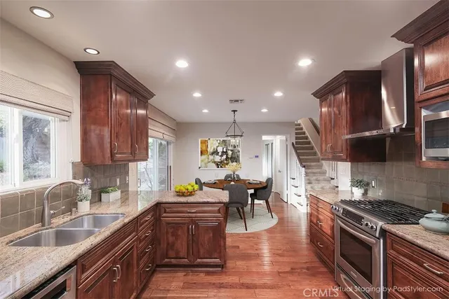 a view of a livingroom with furniture and wooden floor