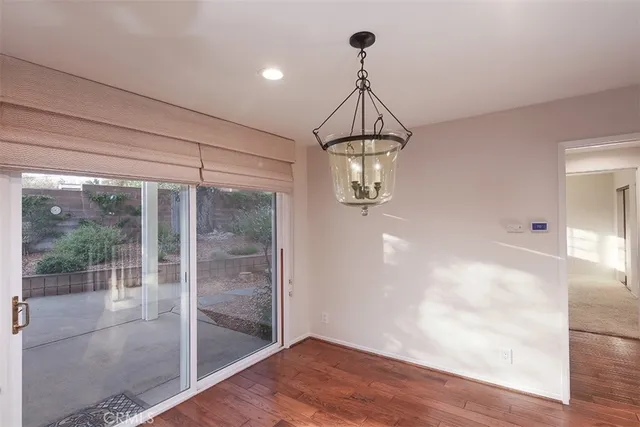 a bathroom with a granite countertop sink a mirror and a shower