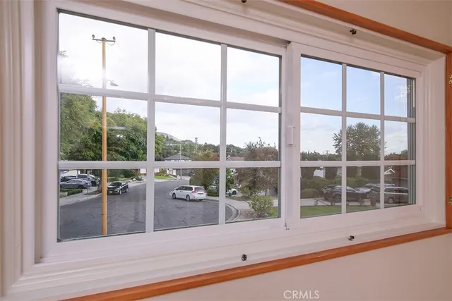 a bedroom with a bed and a flat tv screen on the dresser