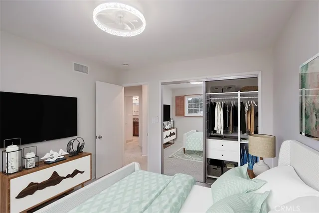 a bedroom with a bed and a view of bathroom