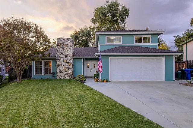 a front view of a house with a garage