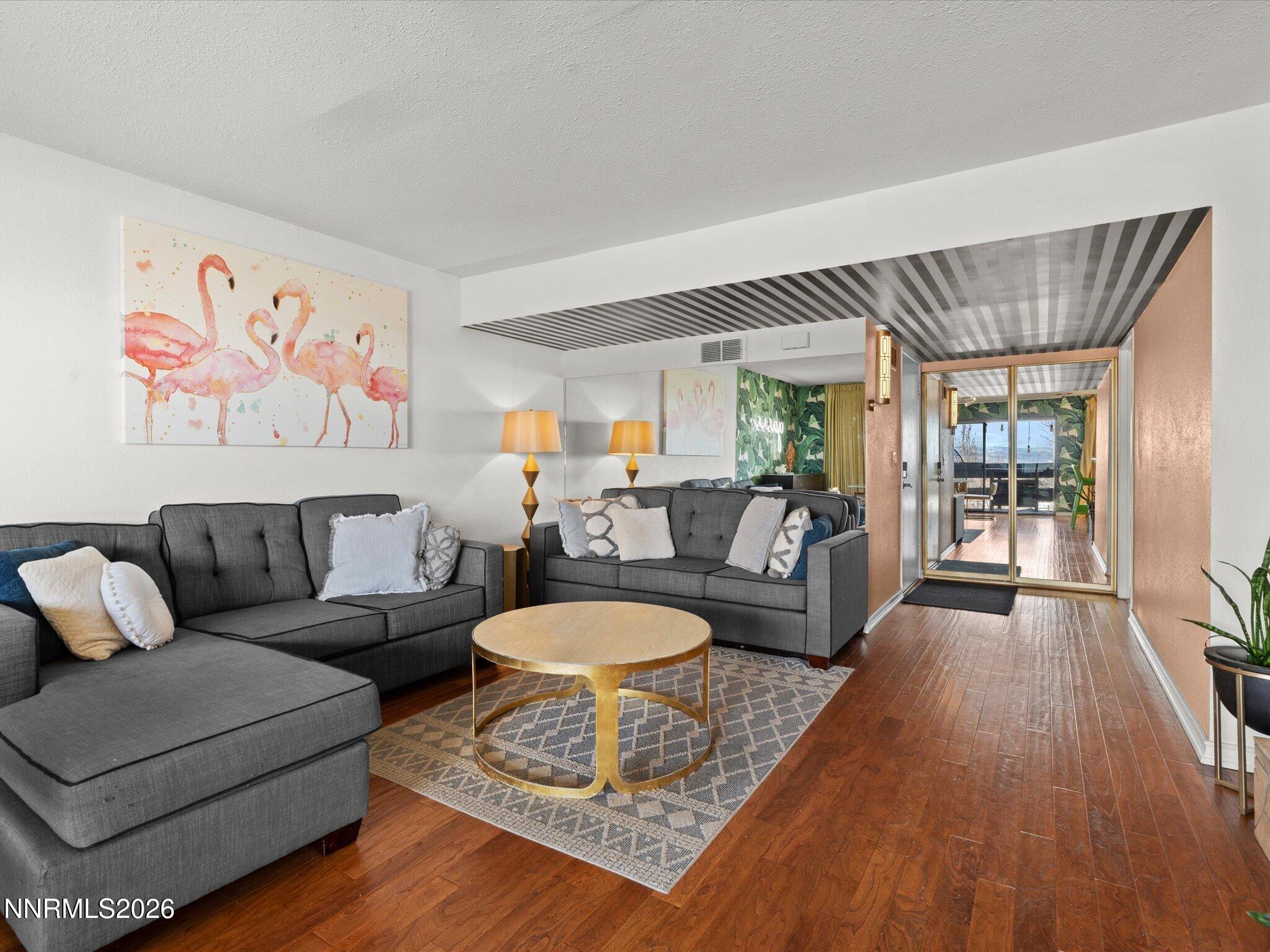 3149 Cashill Boulevard Reno, NV 89509 - Photo 13 of 44 a living room with furniture and a wooden floor