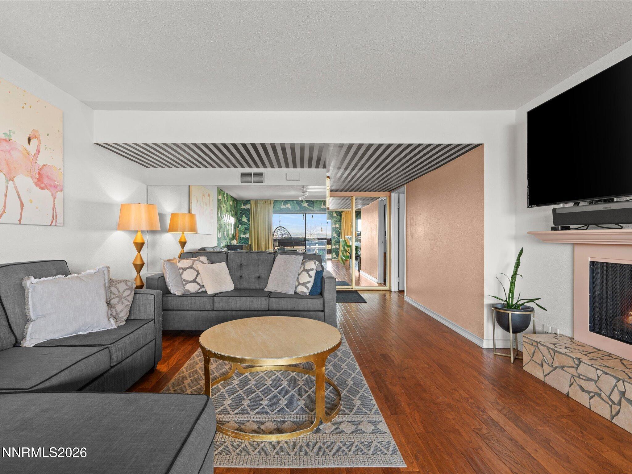 3149 Cashill Boulevard Reno, NV 89509 - Photo 14 of 44 a living room with furniture and a flat screen tv