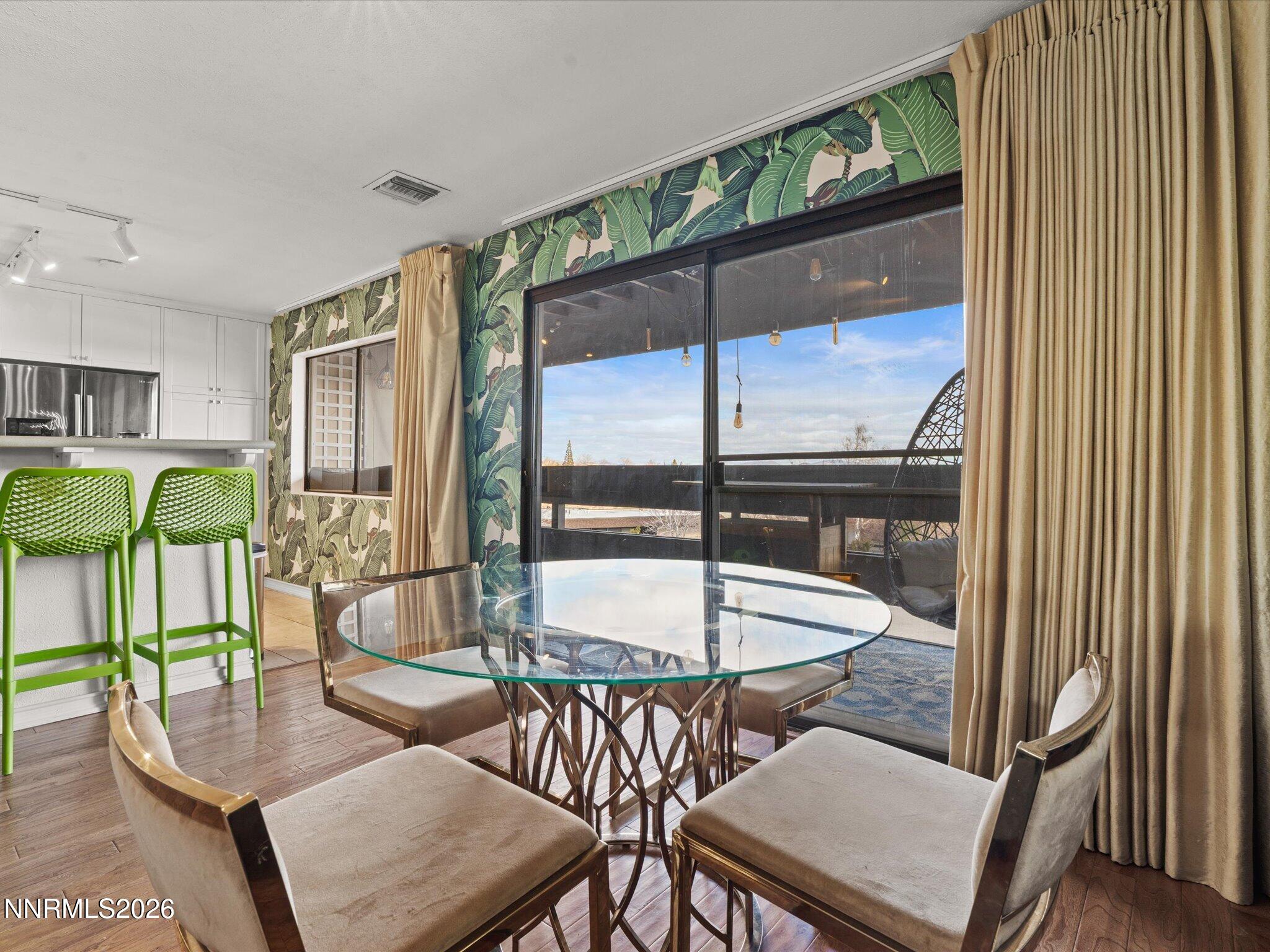 3149 Cashill Boulevard Reno, NV 89509 - Photo 17 of 44 a dining room with furniture and a floor to ceiling window
