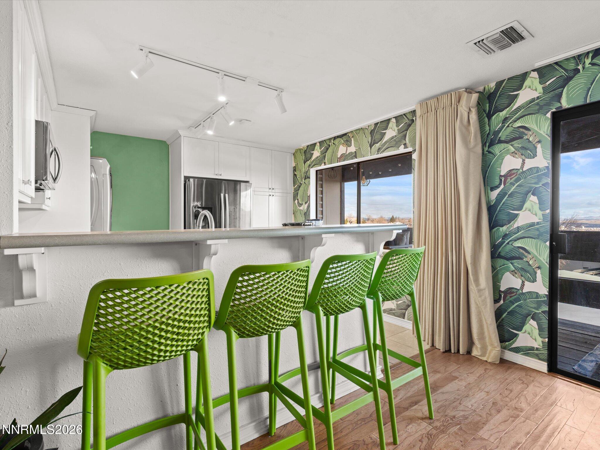 3149 Cashill Boulevard Reno, NV 89509 - Photo 20 of 44 a view of a dining room with furniture window and wooden floor